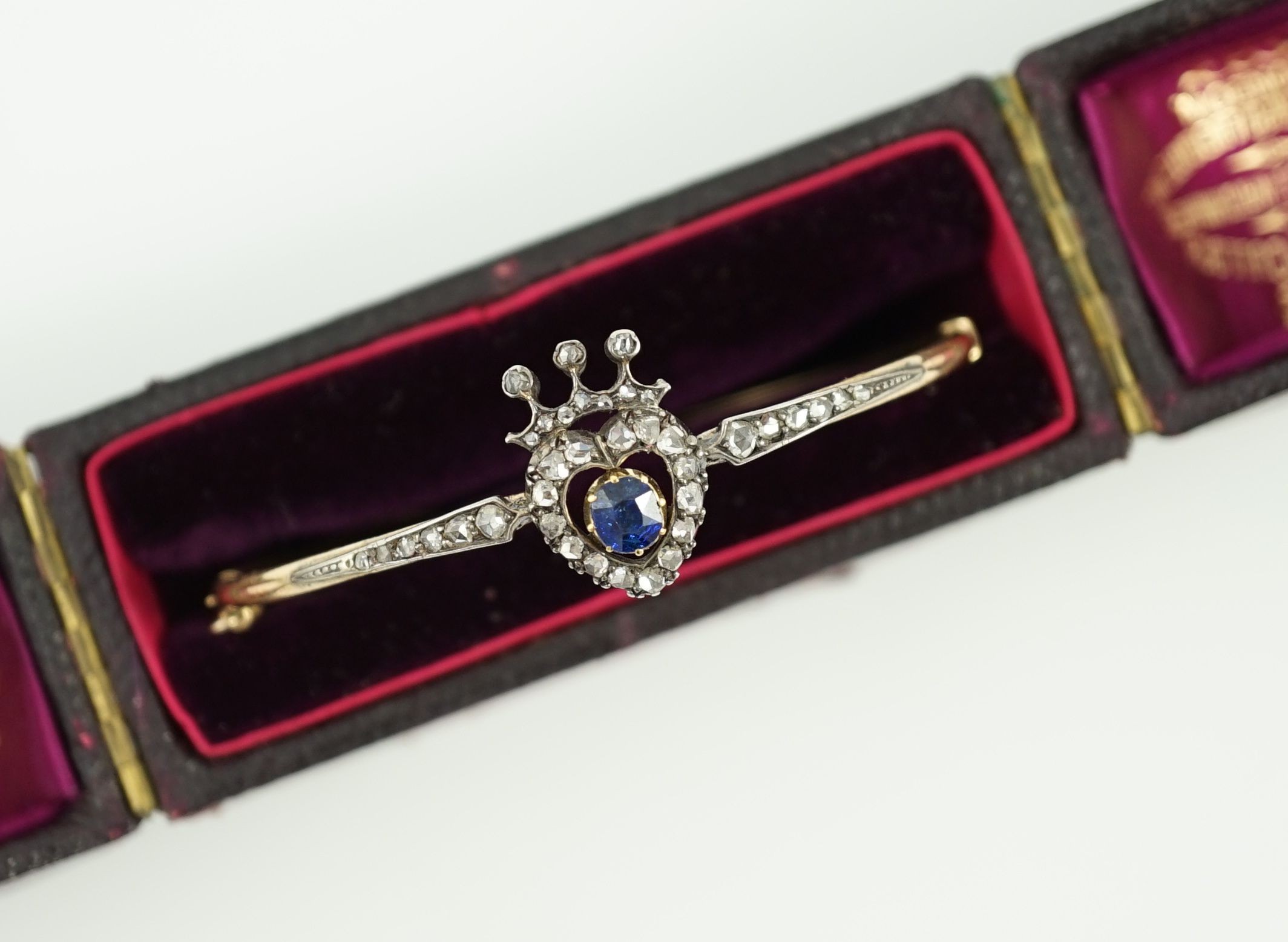 A 19th century gold, sapphire and rose cut diamond set hinged bangle